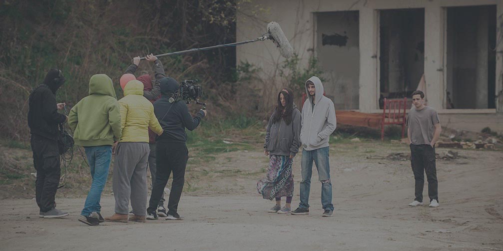 Behind the scene. Film crew filming movie scene outdoor